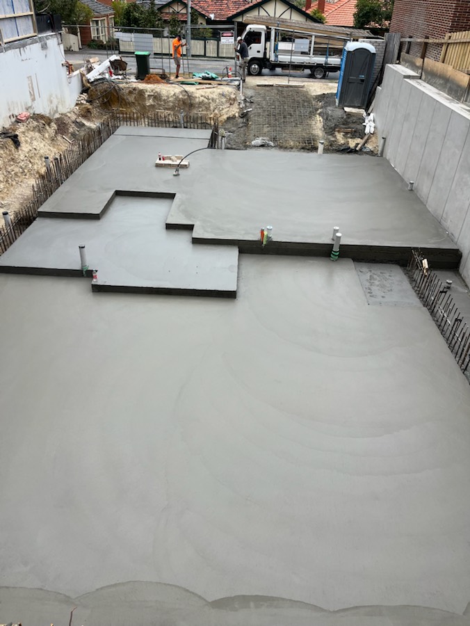 A slab with set-downs beside concrete retaining walls, seen from above